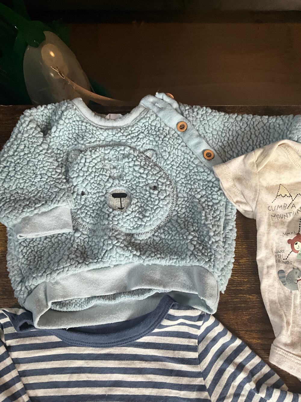 Baby clothes lot of 0-3M assorted pieces. 9 pieces hats onesies and a sweater
